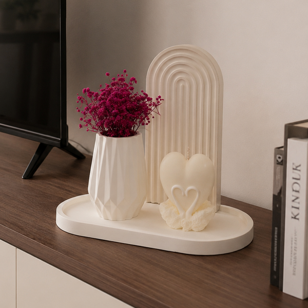 Style your home with this elegant 4-piece décor set featuring a decorative arch, modern vase, heart-shaped candle, and display tray. Perfect for coffee tables, consoles, shelves, and entryways, this minimalist centerpiece adds warmth and timeless charm to modern home décor.